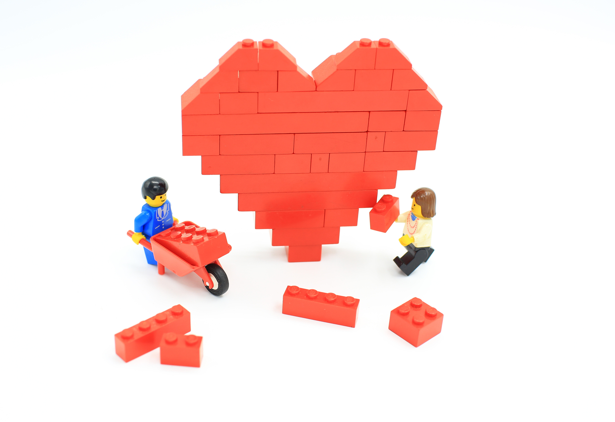 Lego men build a heart